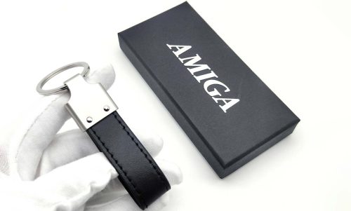 Amiga leather keychain presented next to its sleek black gift box
