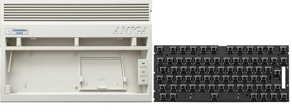 A600 Case Shell and Mechanical Keyboard Plate Amiga 600 top case shell next to the proposed A600 mechanical keyboard plate with switches fitted, shown without keycaps